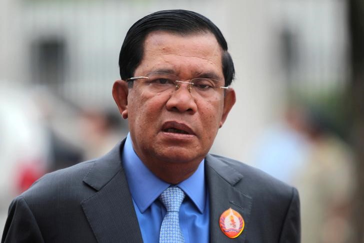 FILE PHOTO: President of the ruling Cambodian People's Party and Prime Minister Hun Sen attends a ceremony to mark the 65th anniversary of the establishment of the party in Phnom Penh
