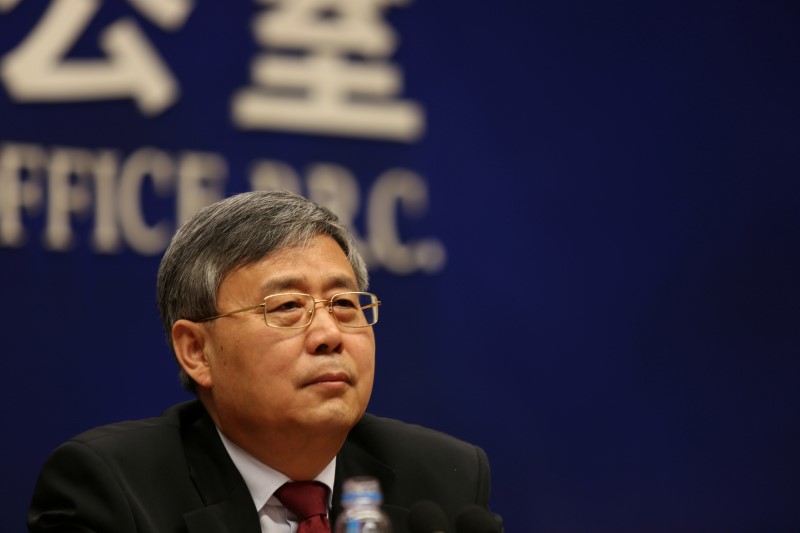 FILE PHOTO: Guo Shuqing, China's newly appointed banking regulator, attends a news conference ahead of China's parliament in Beijing