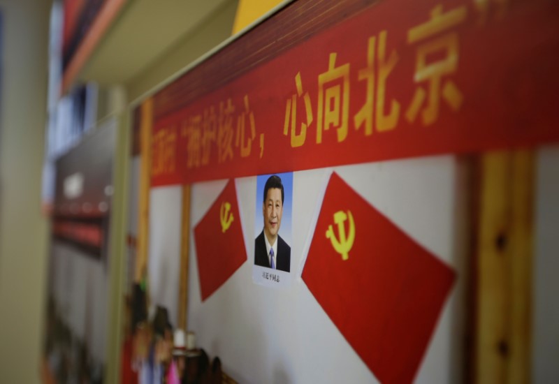 A picture shows Chinese President Xi Jinping's portrait during an exhibition displaying China's achievements for the past five years in Beijing