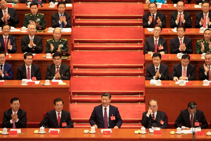 Chairman of the Standing Committee of the National People's Congress (NPC) Zhang Dejiang, former Chinese President Hu Jintao, Chinese President Xi Jinping, former President Jiang Zemin, and Chinese Premier Li Keqiang, are seen during the opening of the 19t