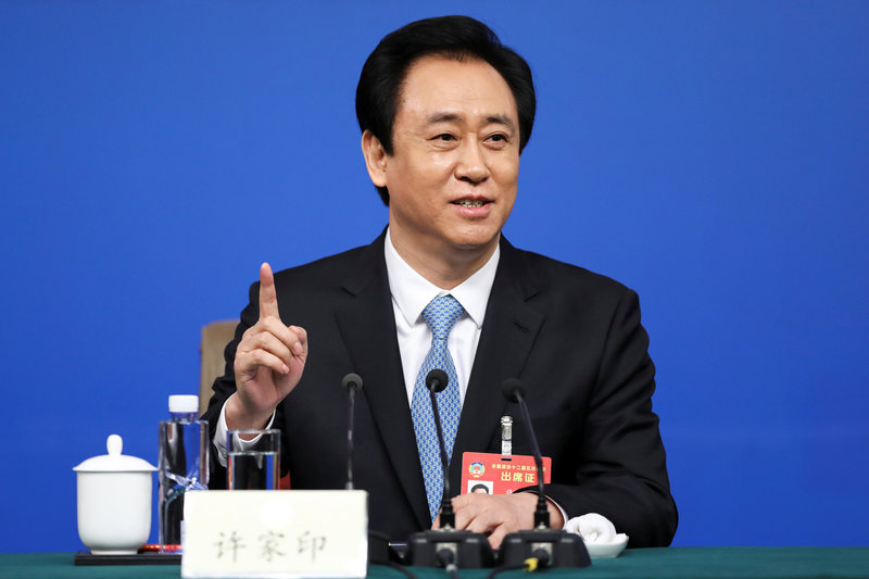Evergrande Group Chairman Xu Jiayin gestures during a press conference for the Fifth Session of the 12th CPPCC National Committee in Beijing
