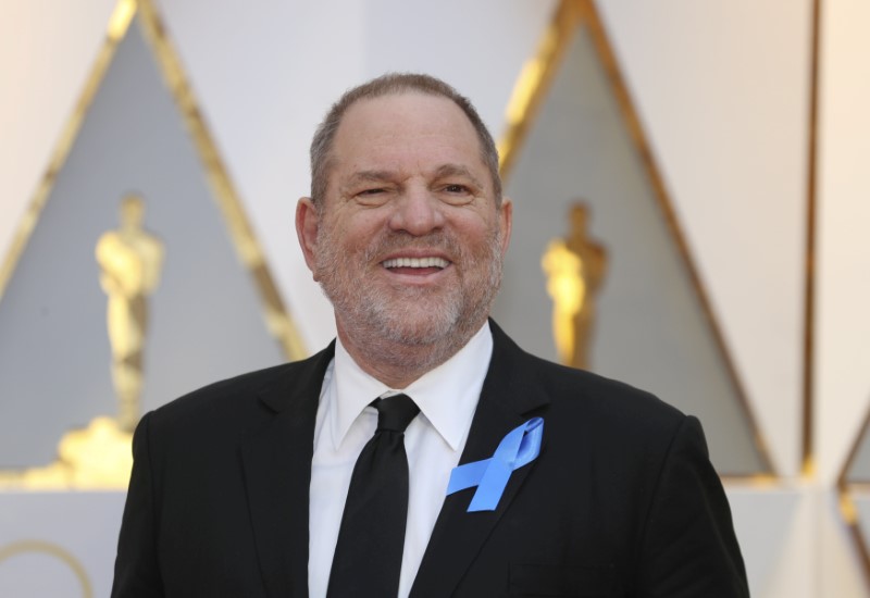 FILE PHOTO: Harvey Weinstein poses on the Red Carpet after arriving at the 89th Academy Awards in Hollywood