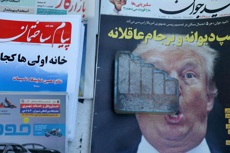 A newspaper featuring a picture of U.S. President Donald Trump is seen in Tehran