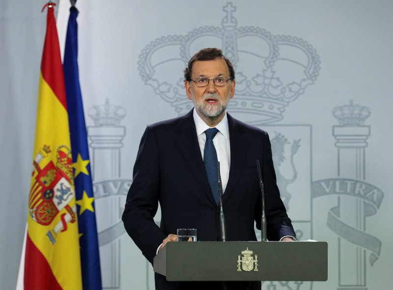 Spanish Prime Minister Mariano Rajoy delivers a statement at the Moncloa Palace in Madrid