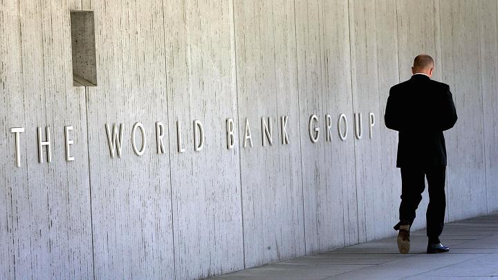 An employee walks outside the World Bank headquarters in Washington, United States.