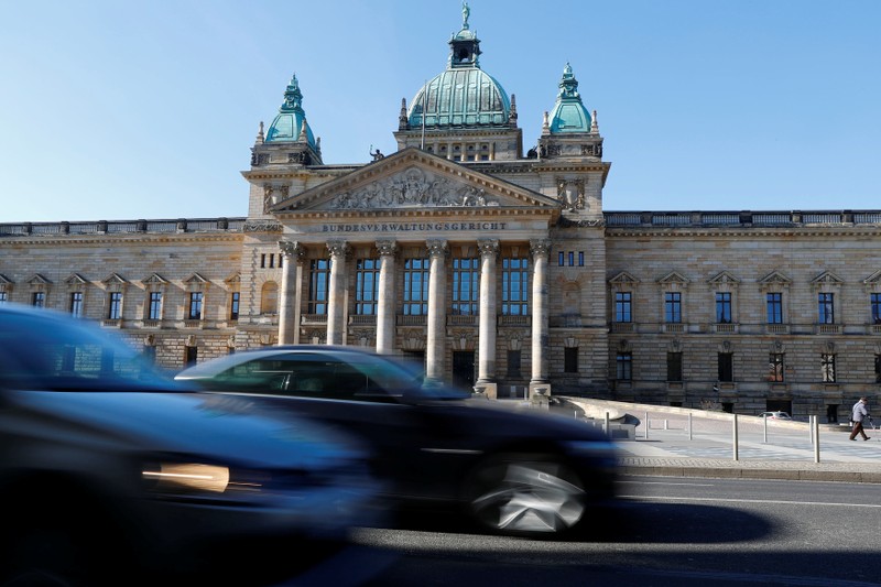 Cars drive past Germany's Federal Administrative Court in Leipzig