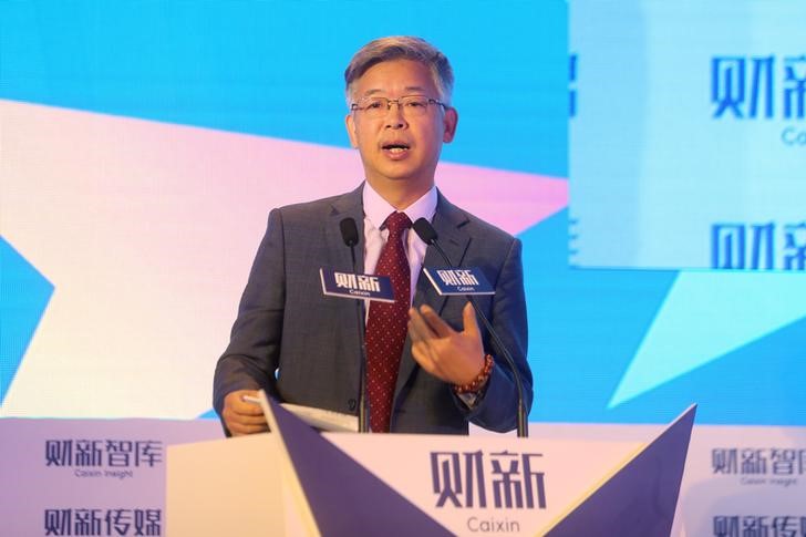 FILE PHOTO: Huang Yiping, Peking University professor and China's central bank policy adviser, speaks at the financial forum Caixin Summit in Beijing