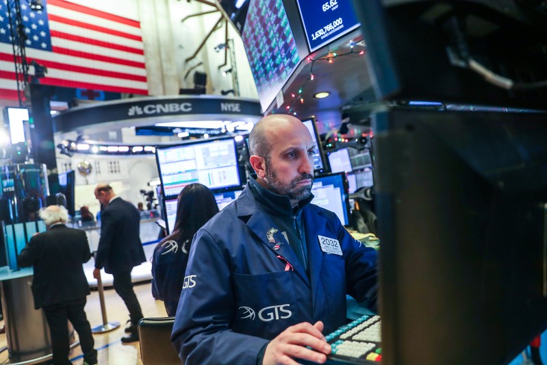 A trader works at his post on the floor of the New York Stock Exchange (NYSE) in New York