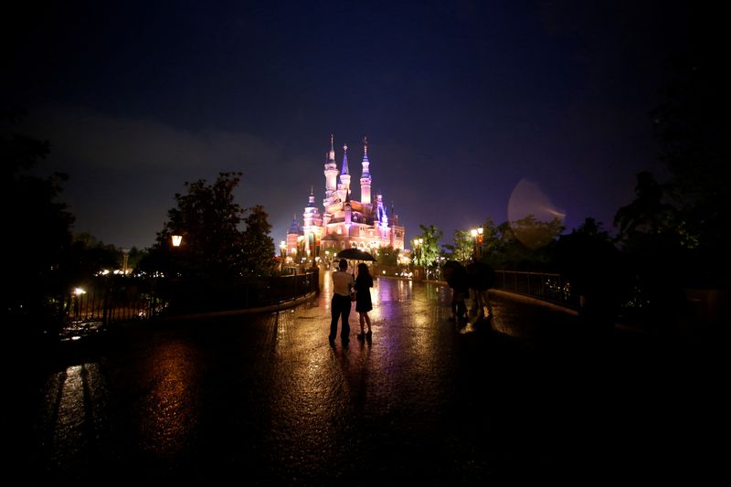 FILE PHOTO: People visit Shanghai Disney Resort as part of the three-day Grand Opening events in Shanghai