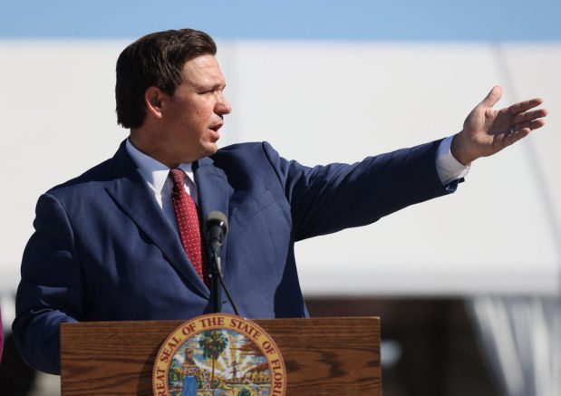 MIAMI GARDENS, FLORIDA - JANUARY 06: Florida Governor Ron DeSantis speaks during a press conference about the opening of a COVID-19 vaccination site at the Hard Rock Stadium on January 06, 2021 in Miami Gardens, Florida. The governor announced that the stadium's parking lot which offers COVID-19 tests will begin to offer COVID-19 vaccinations for residents 65 and older to drive up and get vaccinated. The vaccination site opened today for a trial run but it was not known when it will be open to the general public. (Photo by Joe Raedle/Getty Images)