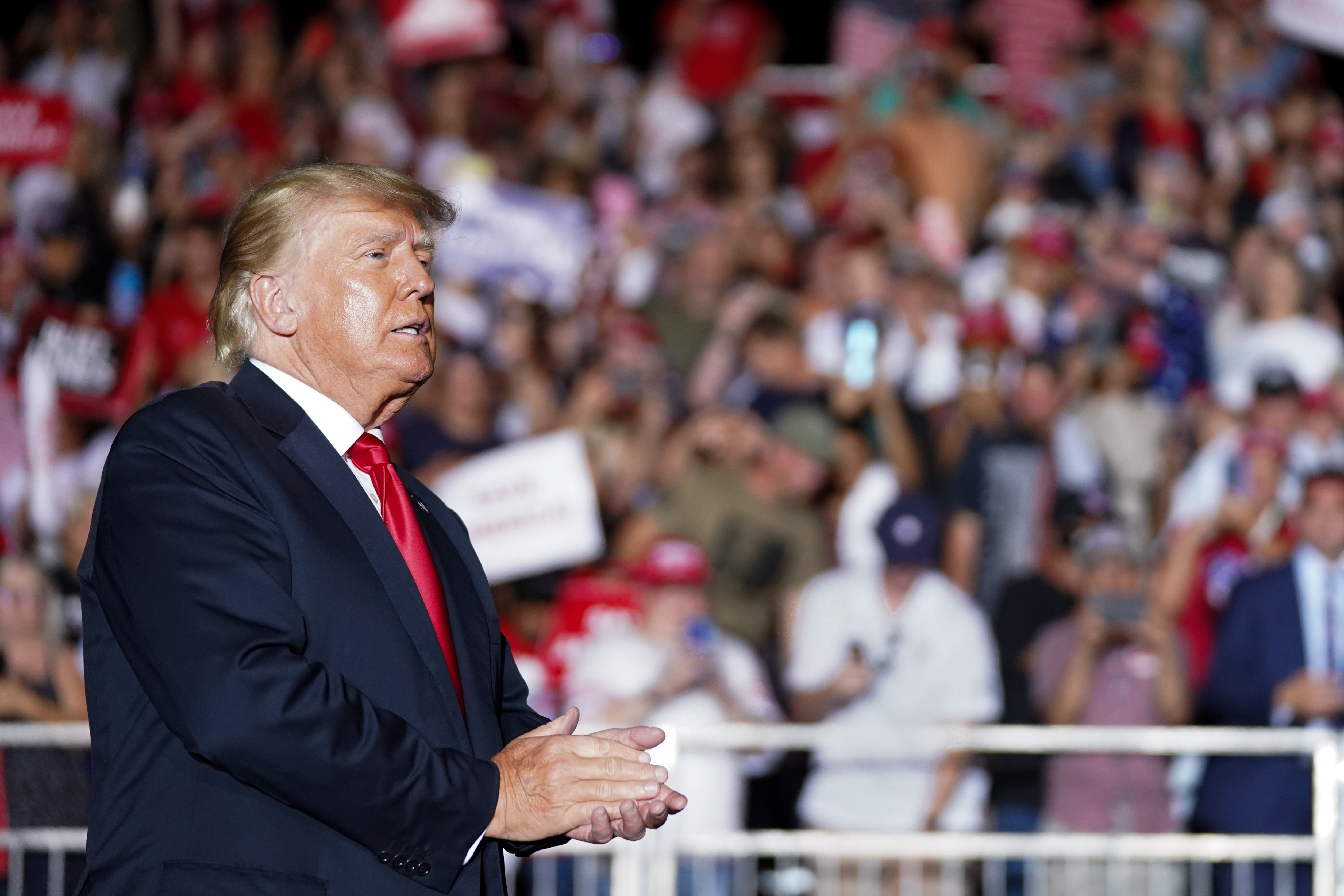 President Donald Trump walks off the stage at the end of a rally on September 25, 2021 in Perry, Georgia. (Photo by Sean Rayford/Getty Images)