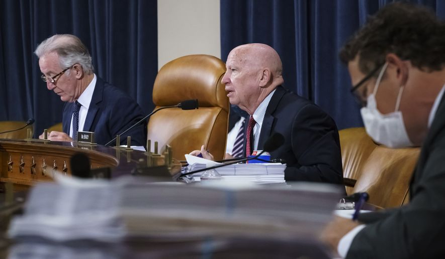 House Ways and Means Committee Chairman Richard Neal, D-Mass., left, and Rep. Kevin Brady, R-Texas, the ranking member, center right, make opening statements as the tax-writing panel continues work on the Democrats' sweeping proposal for tax hikes on big corporations and the wealthy to fund President Joe Biden's $3.5 trillion domestic rebuilding plan, at the Capitol in Washington, Tuesday, Sept. 14, 2021. (AP Photo/J. Scott Applewhite)
