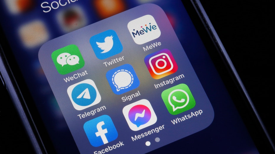 In this photo illustration, the logos of social media applications, WeChat, Twitter, MeWe, Telegram, Signal, Instagram, Facebook, Messenger and WhatsApp is displayed on the screen of an iPhone on October 06, 2021 in Paris, France. Frances Haugen, a former employee of the Facebook social network created by Mark Zuckerberg, told the US Senate on October 05 that Facebook was prioritizing its profits at the expense of security and the impact of the social network on young users. To support her claims, Frances Haugen draws on her two-year experience as a product manager at Facebook and on the thousands of documents she took with her last spring, grouped together under the name of "Facebook Files ". (Photo illustration by Chesnot/Getty Images)