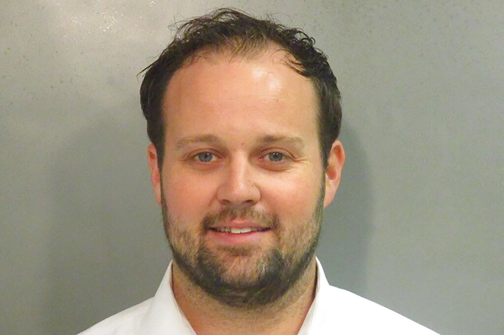 This undated photo provided by Washington County (Ark), Detention Center shows Josh Duggar. A federal judge has sentenced reality TV’s Duggar to about 12 1/2 years in prison for his conviction on one count of receiving child pornography. Prosecutors had asked the court to sentence the former “19 Kids and Counting” star on Wednesday, May 25, 2022, to the maximum 20 years. (Washington County Detention Center via AP)