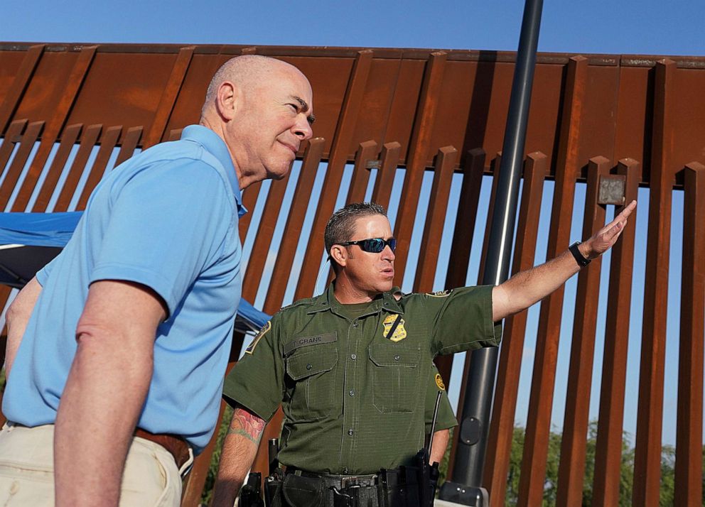 PHOTO: Homeland Security Secretary Alejandro Mayorkas, left, listens to Deputy patrol agent in charge of the US Border Patrol Anthony Crane as he tours the section of the border wall, May 17, 2022, in Hidalgo, Texas.