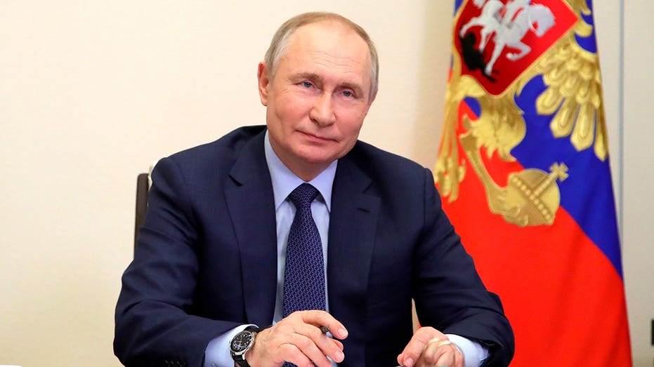 Vladimir Putin attends a meeting