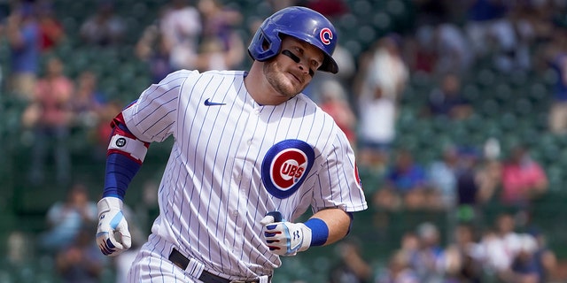 Cubs' Ian Happ rounds the bases after hitting his second home run against the Washington Nationals, May 20, 2021, in Chicago.