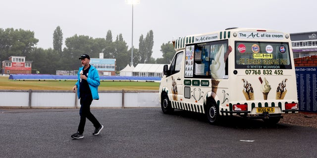 DERBY, ENGLAND - JULY 21: Spectators buy Ice Cream's from an Ice Cream Van as rain stops play during the LV= Insurance County Championship match between Derbyshire and Nottinghamshire at The Incora County Ground on July 21, 2022 in Derby, England. (Photo by George Wood/Getty Images)