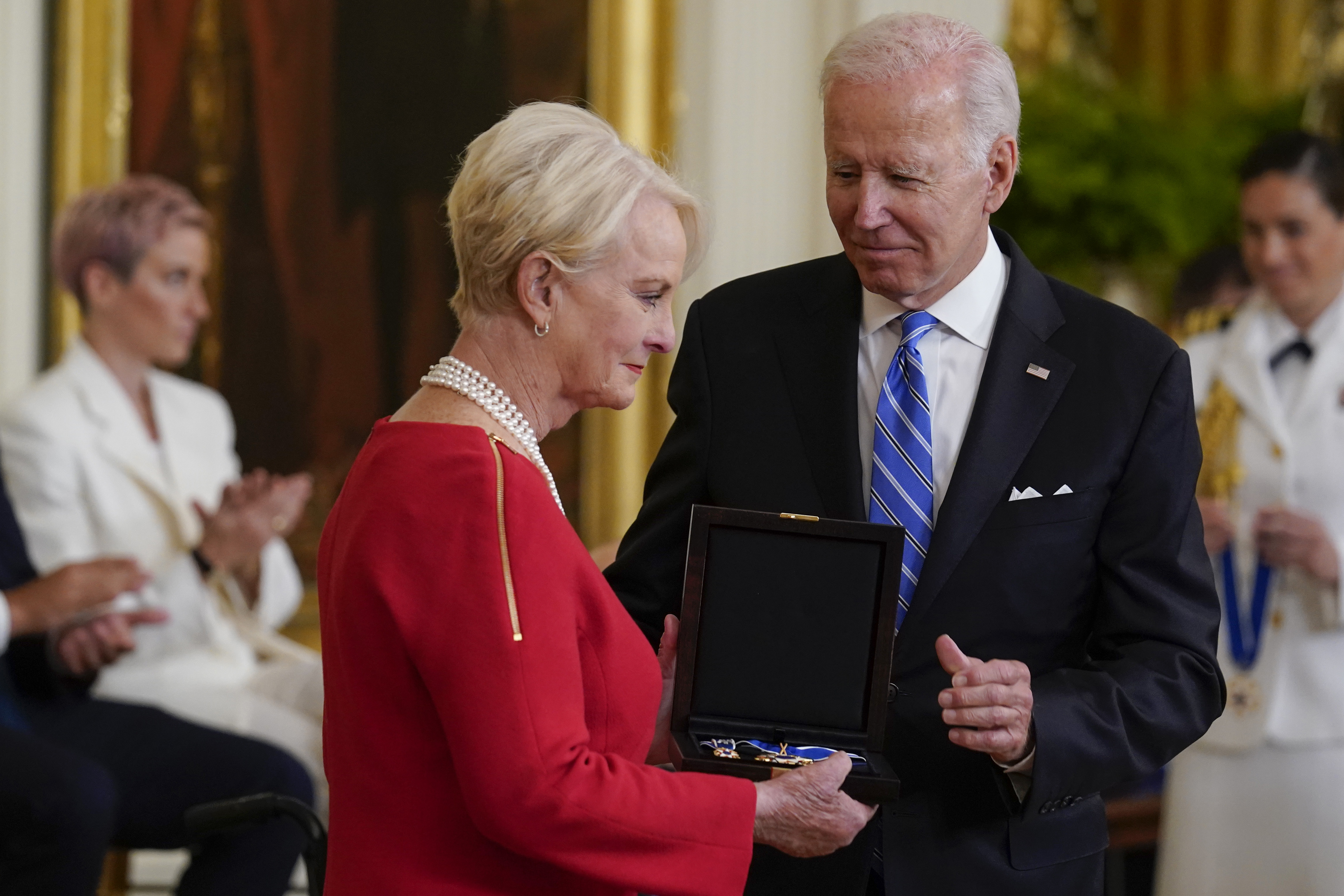 President Joe Biden posthumously awards the nation's highest civilian honor, the Presidential Medal of Freedom, to Sen. John McCain of Arizona as his wife Cindy McCain accepts the award during a ceremony in the East Room of the White House in Washington, Thursday, July 7, 2022. (AP Photo/J. Scott Applewhite)