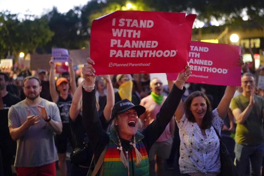 Supporters of abortion rights chant slogans outside a Planned Parenthood clinic during a protest in West Hollywood, Calif., Friday, June 24, 2022. The U.S. Supreme Court's decision to end constitutional protections for abortion has cleared the way for states to impose bans and restrictions on abortion — and will set off a series of legal battles. (AP Photo/Jae C. Hong)