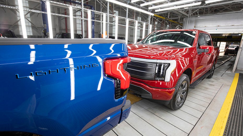 A blue and red Ford F-150 Lightning all-electric truck