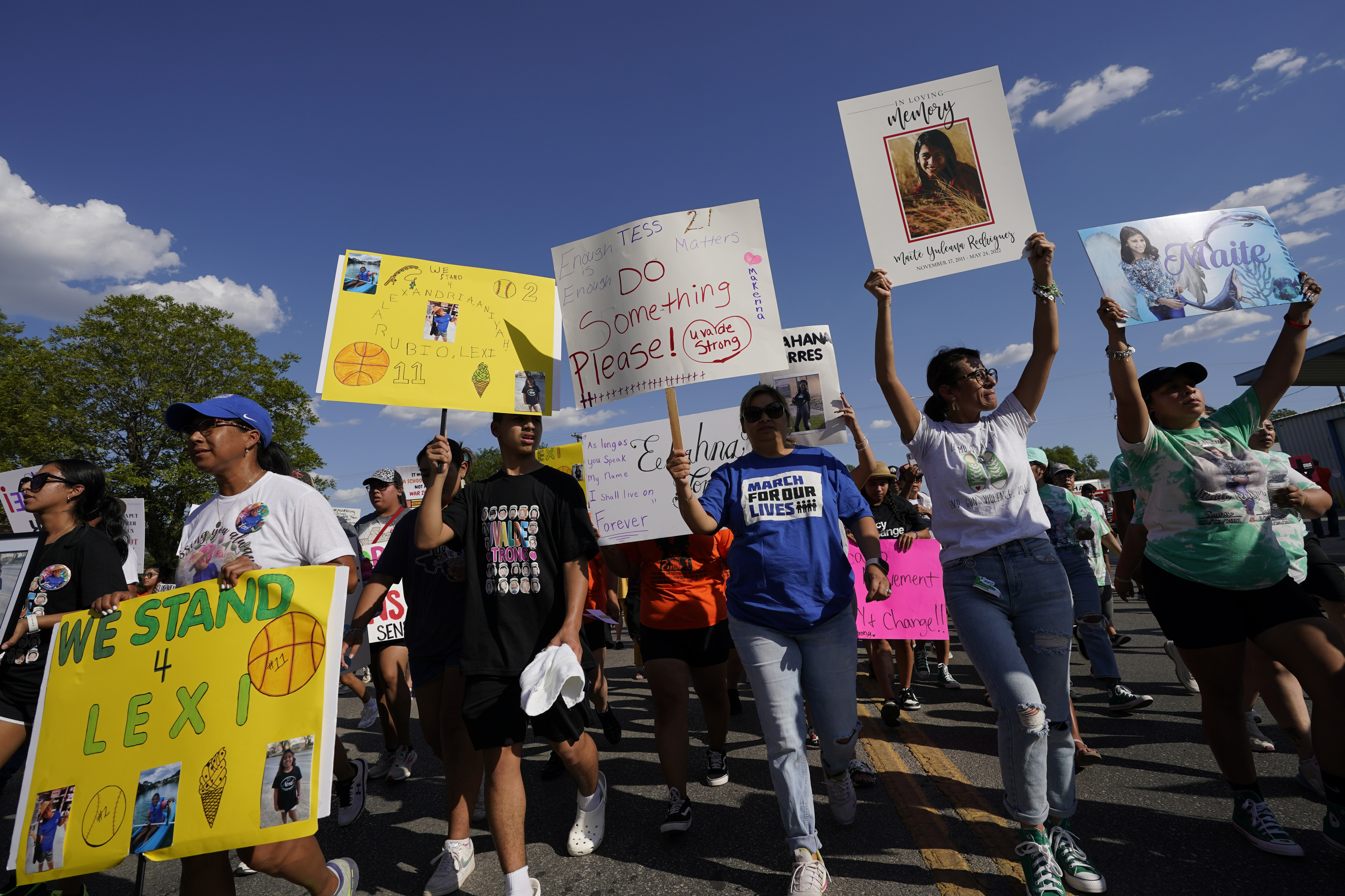 Family and friends of those killed and injured in the school shooting at Robb Elementary take part in a protest march and rally, Sunday, July 10, 2022, in Uvalde, Texas. (AP Photo/Eric Gay)