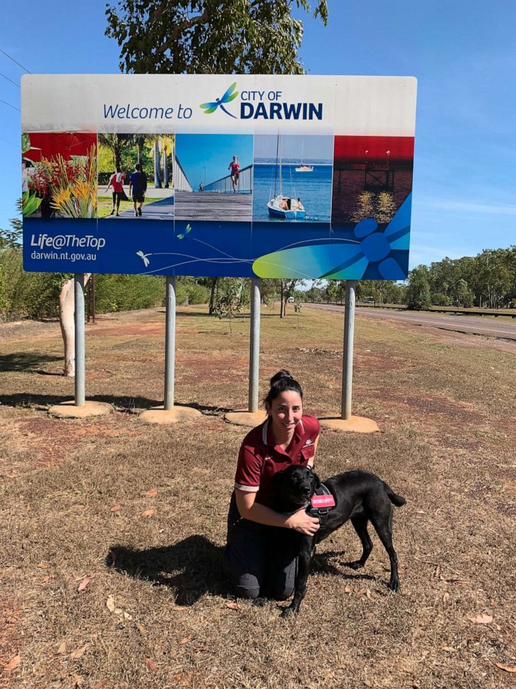 PHOTO: Detector Dog Zinta is shown with her handler in Darwin, Australia.