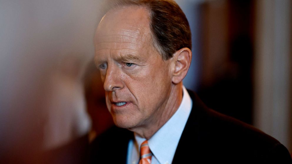 PHOTO: Sen. Pat Toomey walks out of the Senate Chambers during a nomination vote in the U.S. Capitol Building in Washington, Aug. 1, 2022. 