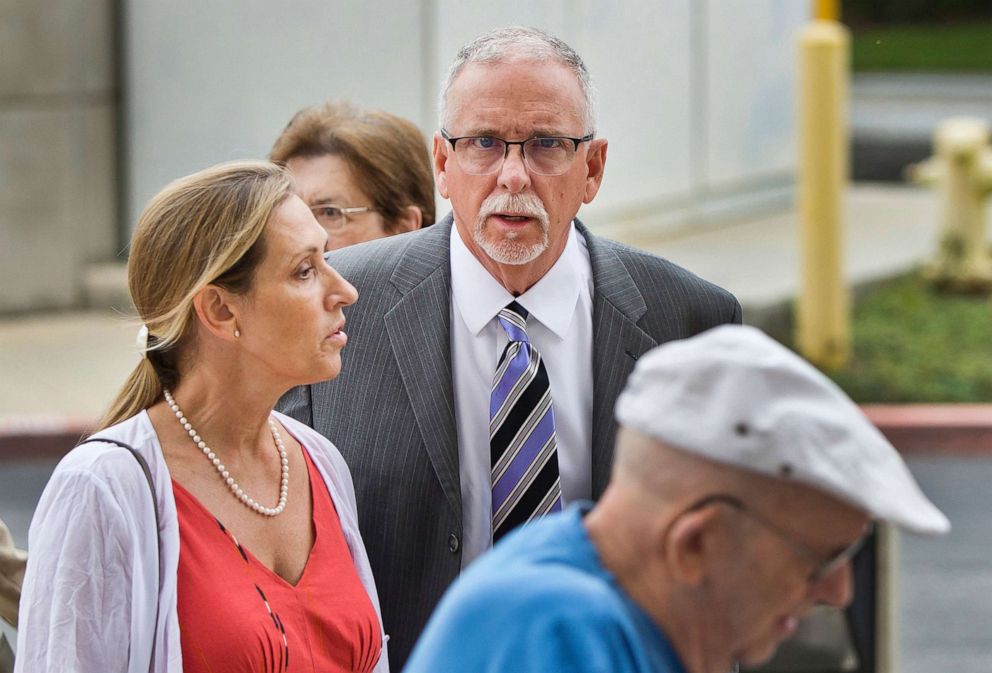 PHOTO: UCLA gynecologist James Heaps, center, and his wife, Deborah Heaps, arrive at Los Angeles Superior Court, June 26, 2019.