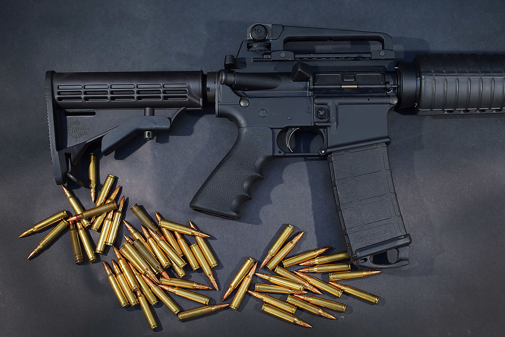 MIAMI, FL - DECEMBER 18: In this photo illustration, a Rock River Arms AR-15 rifle is seen with ammunition on December 18, 2012 in Miami, Florida. The weapon is similar in style to the Bushmaster AR-15 rifle that was used during a massacre at an elementary school in Newtown, Connecticut. Firearm sales have surged recently as speculation of stricter gun laws and a re-instatement of the assault weapons ban following the mass shooting. (Photo illustration by Joe Raedle/Getty Images)
