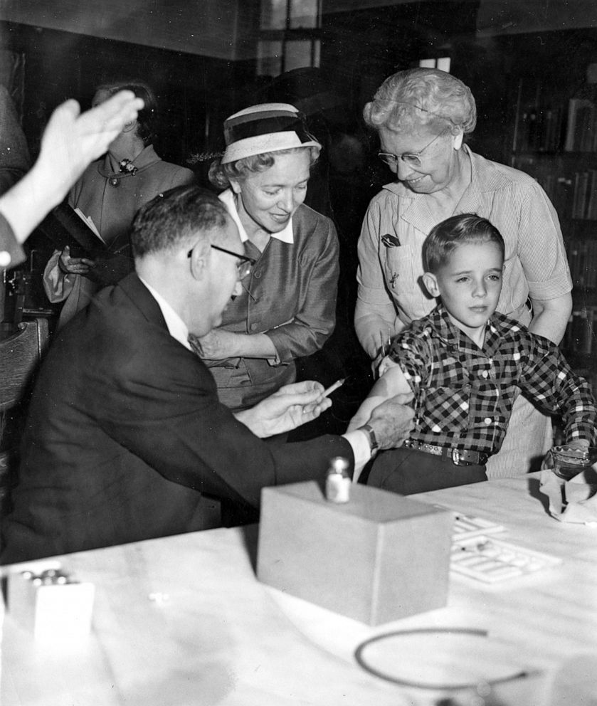 PHOTO: A doctor administers a polio vaccine shot as inoculation of school children begins at St. John's parochial school in Quincy, Mass., on May 12, 1954.
