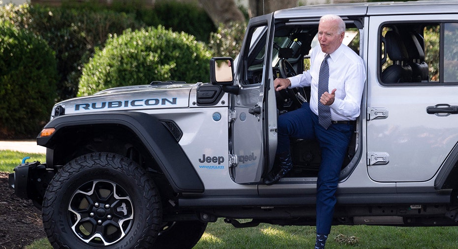 Biden exiting a Jeep