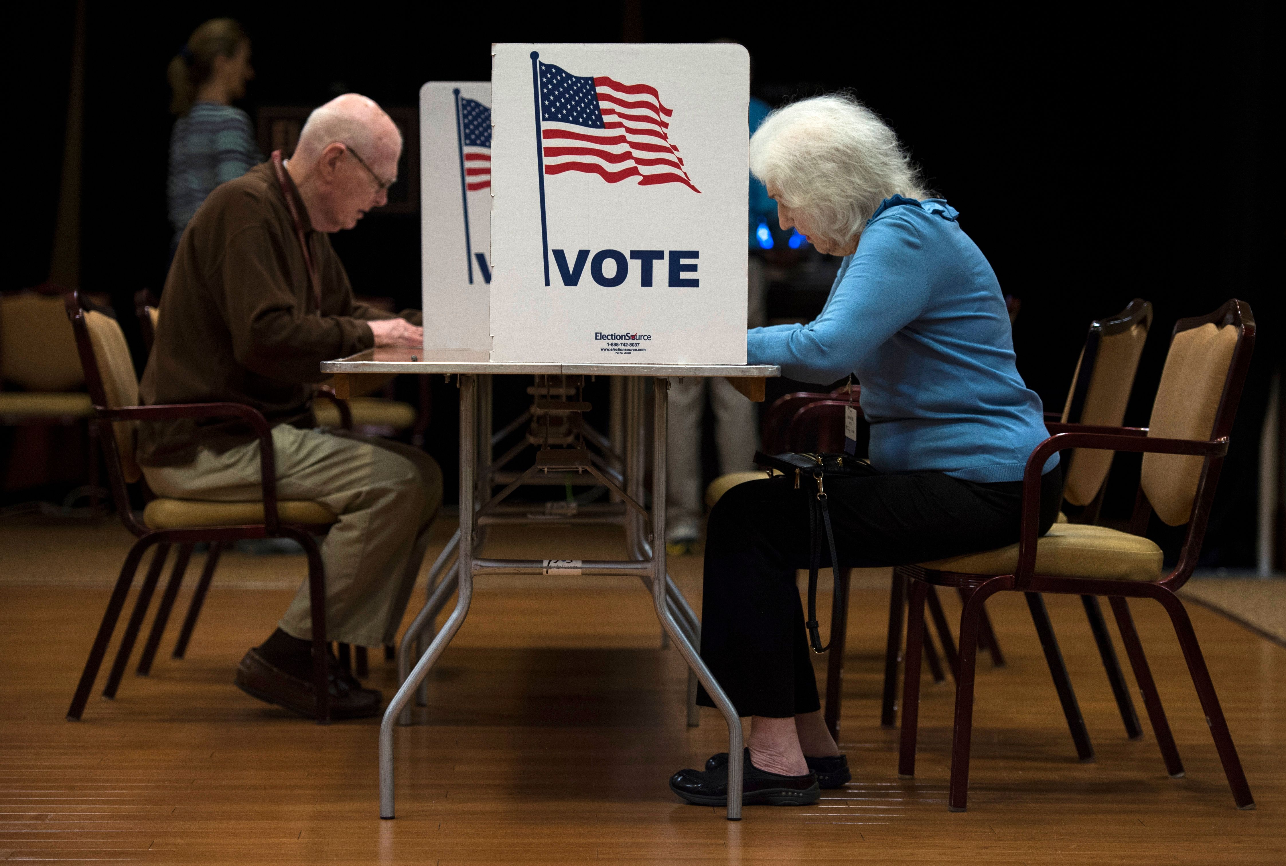 People vote at the Greenspring Retirement center during the mid-term election day in Fairfax, Virginia on November 6, 2018. (Photo by ANDREW CABALLERO-REYNOLDS / AFP) (Photo credit should read ANDREW CABALLERO-REYNOLDS/AFP via Getty Images)