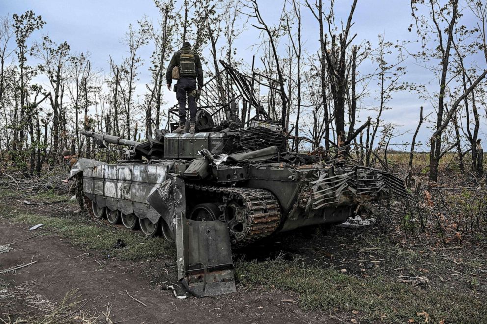 PHOTO: A Ukranian soldier stands atop an abandoned Russian tank near a village on the outskirts of Izyum, Kharkiv Region, eastern Ukraine, Sept. 11, 2022. The territorial shifts were one of Russia's biggest reversals since the earliest days of the war.