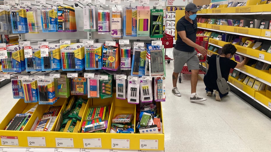 Shoppers look for school supplies at a store