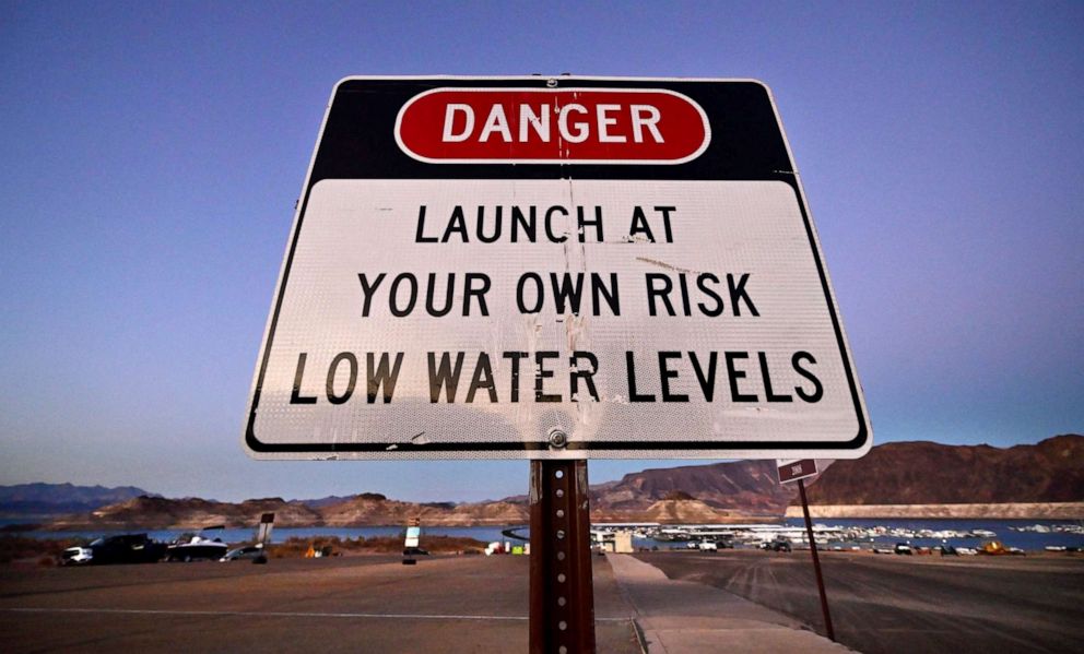 PHOTO: A sign warns people of danger to launch boats due to low water levels at drought-stricken Lake Mead on September 15, 2022 in Boulder City, Nevada.