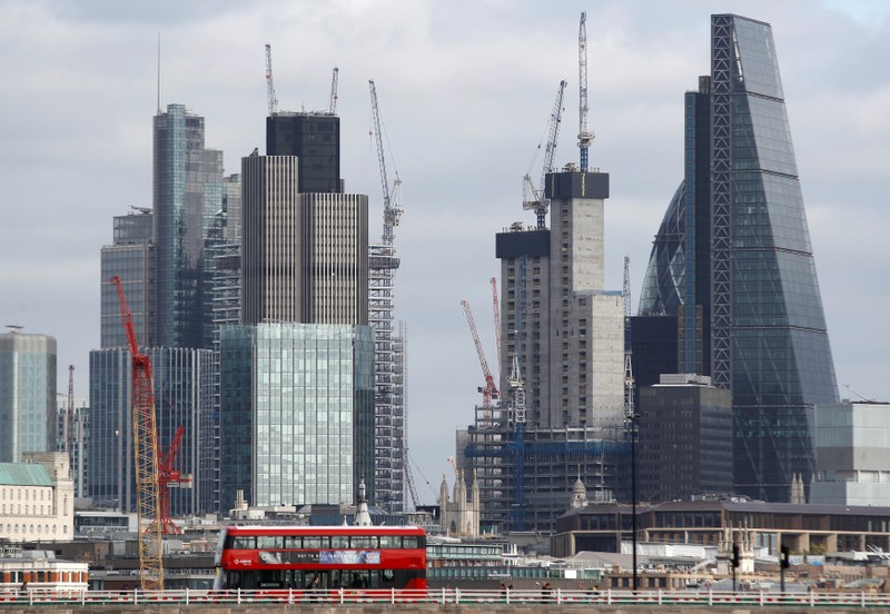 FILE PHOTO: Buildings in the City of London are seen behind Waterloo Bridge in London