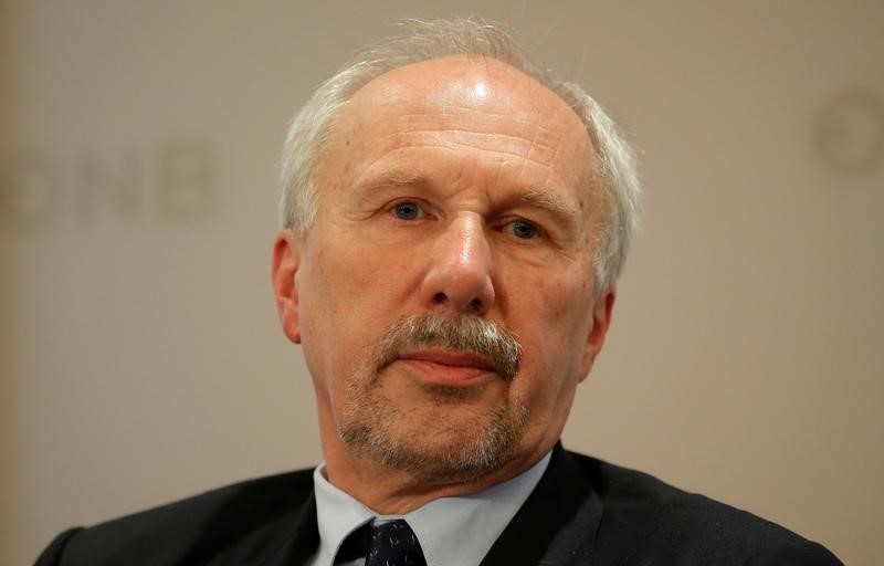 FILE PHOTO: ECB Governing Council member Nowotny listens during a news conference in Vienna
