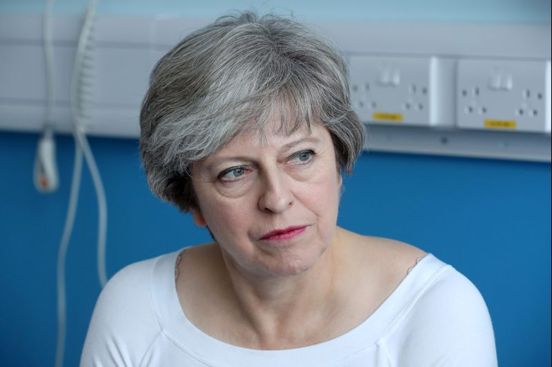 Britain's Prime Minister Theresa May speaks to patients during a round table discussion as they visit the Renal Transplant Unit at the Royal Liverpool University Hospital, Liverpool