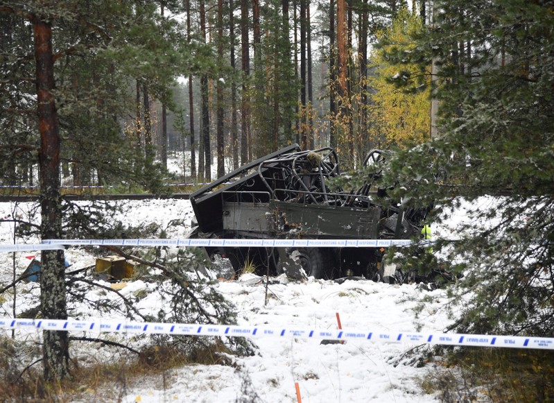A military truck is pictured after a crash with a passenger train in Raasepori