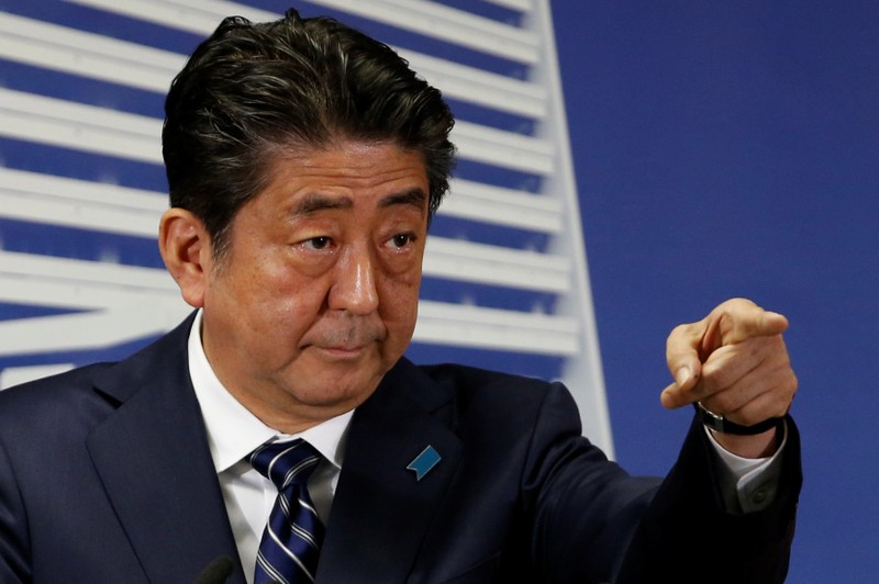 Japan's Prime Minister Shinzo Abe, who is also leader of the Liberal Democratic Party, attends a news conference in Tokyo