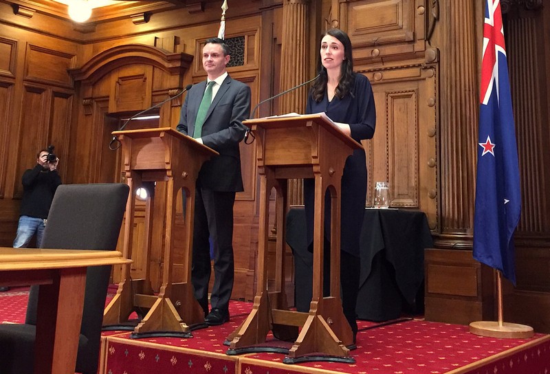 New Zealand's Prime Minister-designate Jacinda Ardern speaks as she stands next to New Zealand Green Party leader James Shaw in Wellington