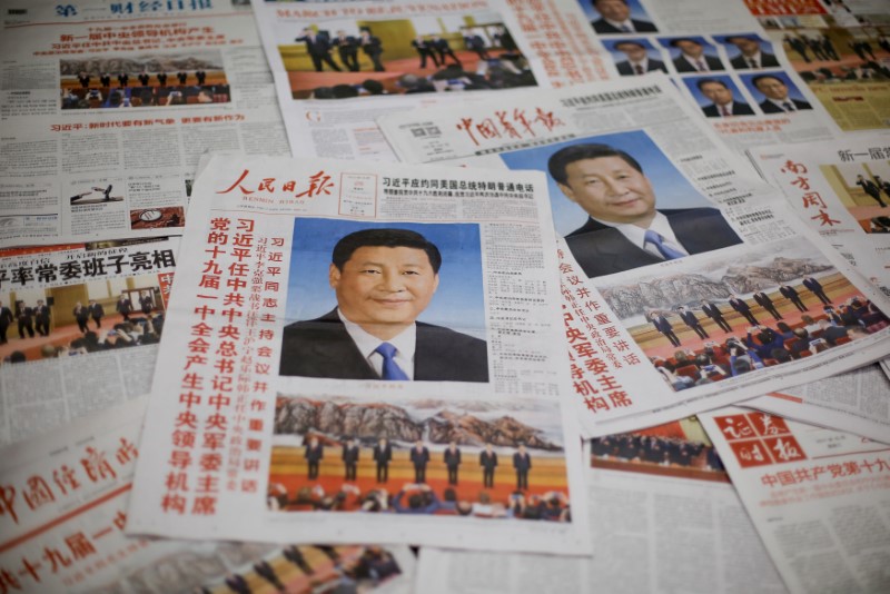 Photo illustration shows the front page of Communist Party's flagship newspaper the People's Daily and other newspapers one day after the unveiling of the new Politburo Standing Committee in Beijing