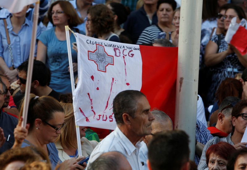 People protest against the assassination of investigative journalist Daphne Caruana Galizia last Monday, in Valletta