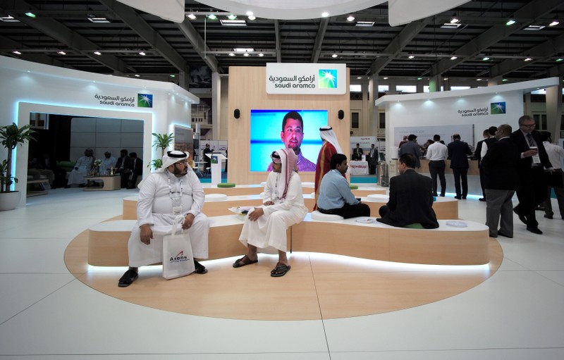 Visitors are seen at the Saudi Aramco stand at the Middle East Process Engineering Conference & Exhibition in Manama