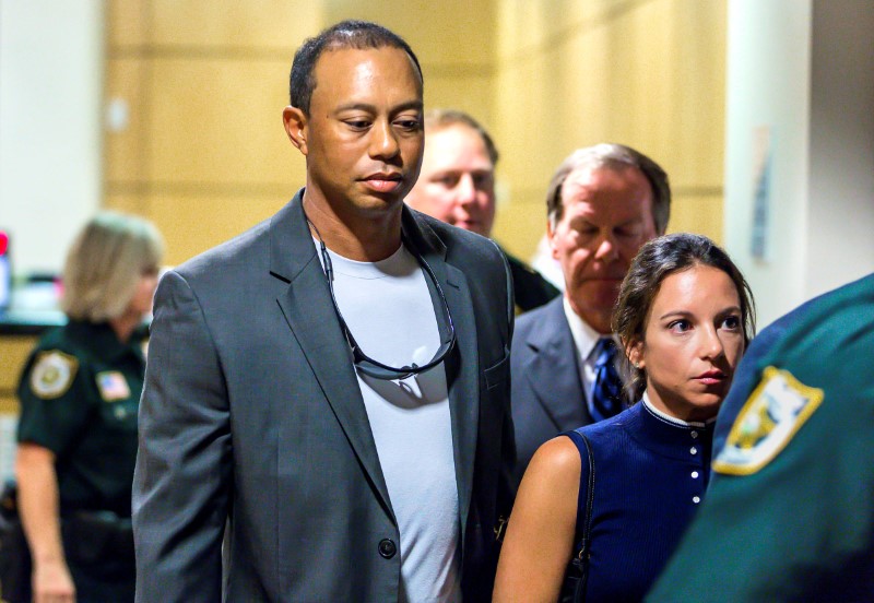 Golfer Woods leaves court after he pleaded guilty to a charge of reckless driving