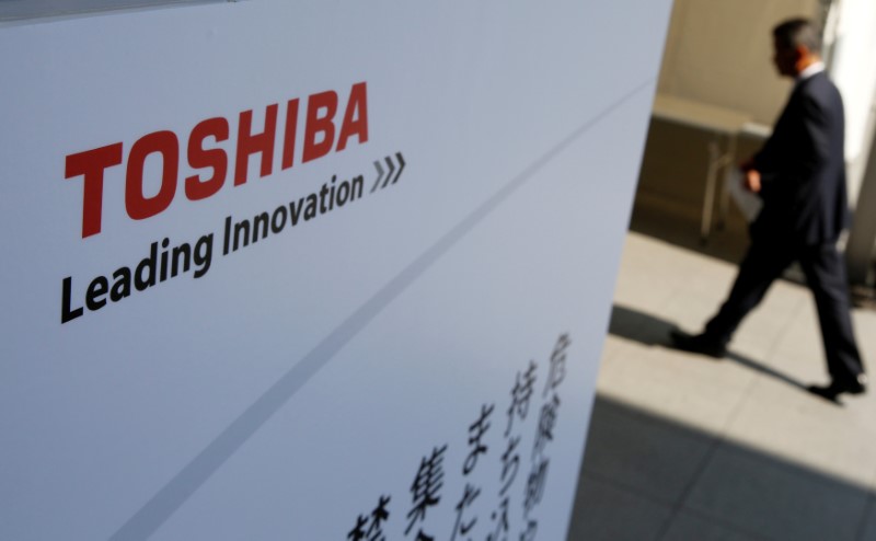 FILE PHOTO: The logo of Toshiba is seen as a shareholder arrives at Toshiba's extraordinary shareholders meeting in Chiba, Japan