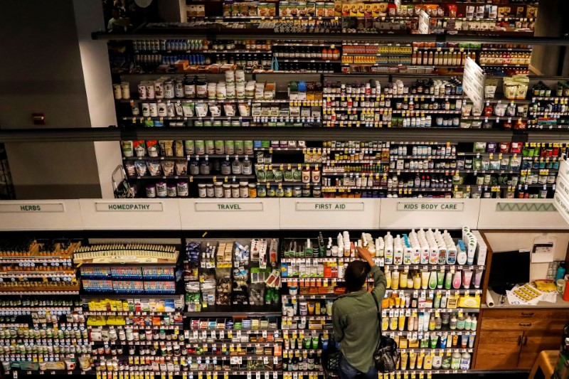 FILE PHOTO: Customers shop at a Whole Foods store in New York