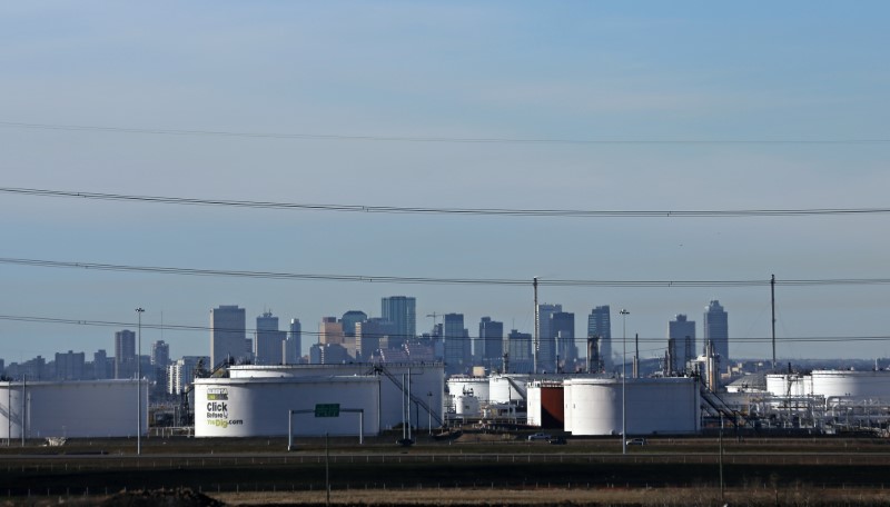 Crude oil storage tanks at Enbridge's facility in Sherwood Park are seen against the skyline of Edmonton