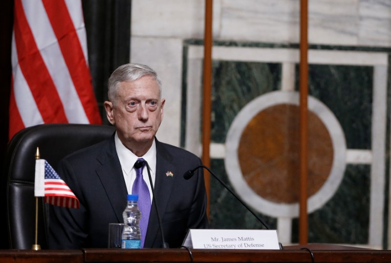 Mattis listens to question during joint news conference in New Delhi